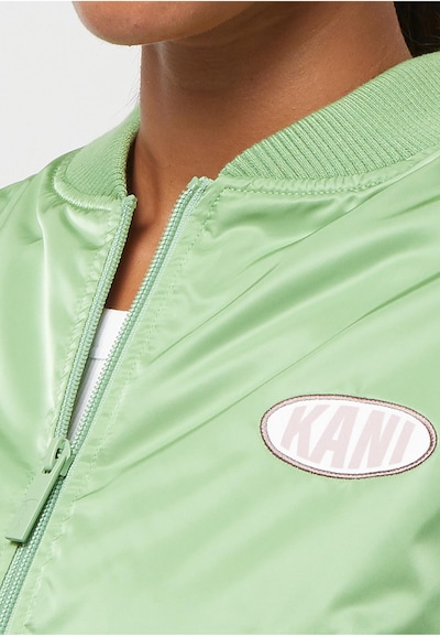 Karl Kani Between-Season Jacket 'Woven Signature Short OS' in Apple / White, Item view