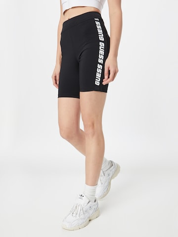 GUESS Skinny Sportovní kalhoty – černá: přední strana