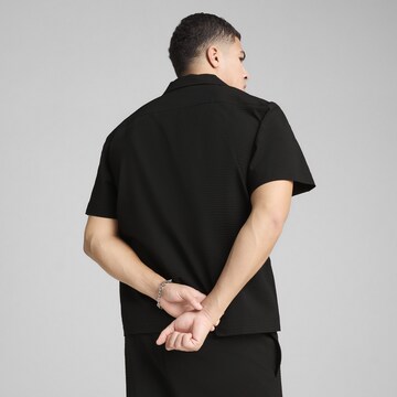 PUMA Comfort fit Functioneel shirt 'Wardrobe Ess' in Zwart