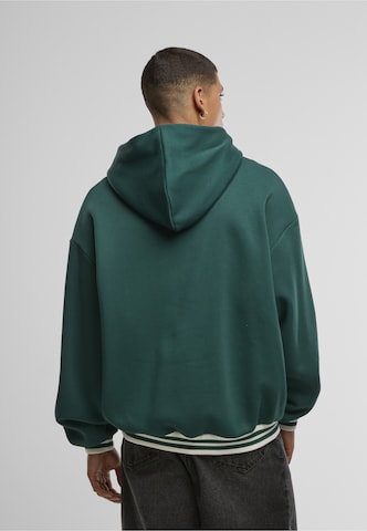 Karl Kani Sweatshirt 'Cursive Varsity' in Grün