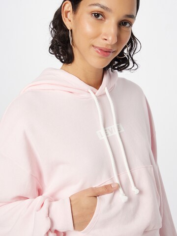 LEVI'S ® Collegepaita 'Graphic Laundry Hoodie' värissä vaaleanpunainen