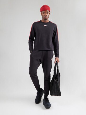 Reebok Sportsweatshirt in Zwart