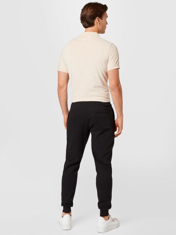 Tommy Jeans Tapered Hose in Schwarz