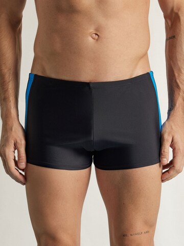 IUMAN Intimissimi Swim Trunks in Black: front