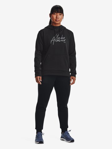 Effilé Pantalon de sport UNDER ARMOUR en noir