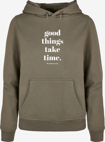 Merchcode Sweatshirt 'Good Things Take Time' in Groen: voorkant