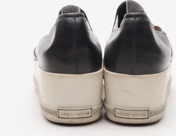 Miu Miu Flats & Loafers in 39 in Black