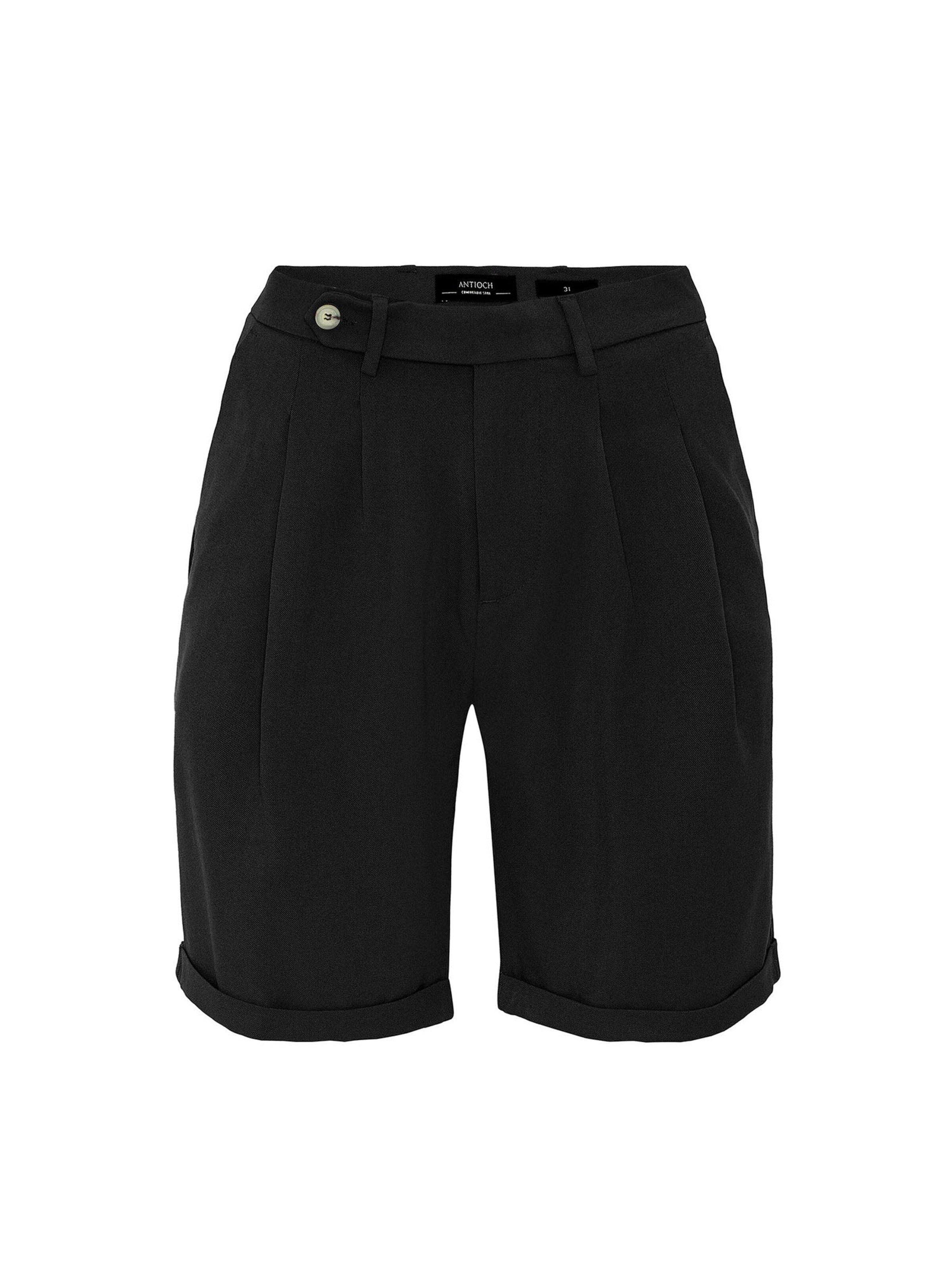 Antioch Regular Pleat-front trousers in Black: front