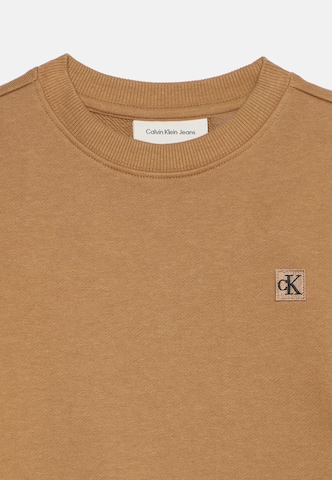 Calvin Klein Jeans - Sudadera en marrón: frente