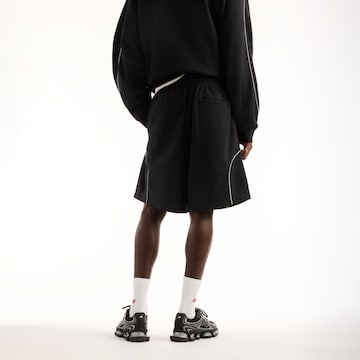 Loosefit Pantalon 'Trackside French Terry Short 7"' new balance en noir