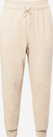 Effilé Pantalon de sport NIKE en beige : devant