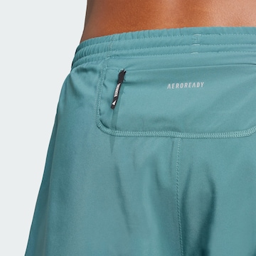 regular Pantaloni sportivi 'Own The Run' di ADIDAS PERFORMANCE in verde