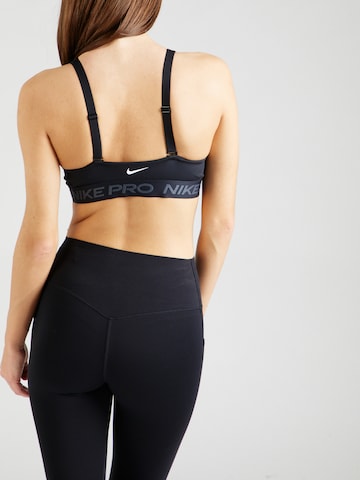 NIKE Bustier Urheilurintaliivit 'INDY' värissä musta