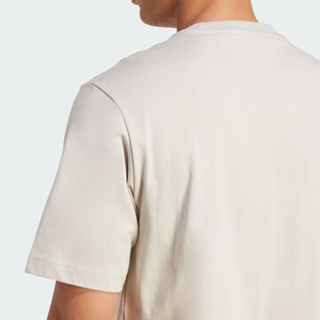 ADIDAS SPORTSWEAR Λειτουργικό μπλουζάκι 'Collegiate Lineage' σε μπεζ