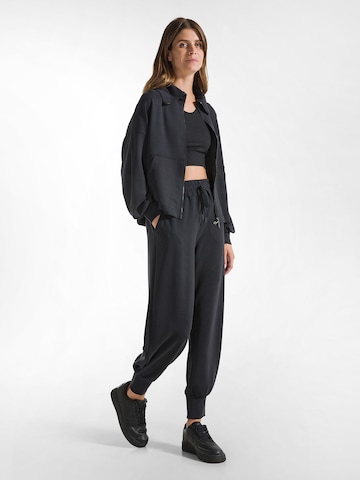 DEHA Slim fit Trousers in Black: front