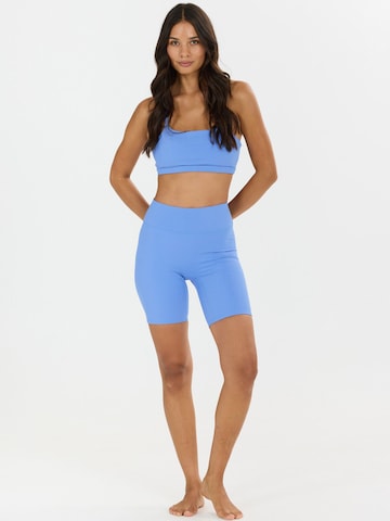 Skinny Pantaloni sport 'Blossom' de la Athlecia pe albastru