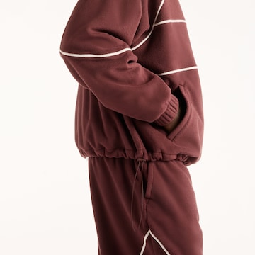 new balance Trui 'Trackside Polar Fleece Hoodie' in Rood