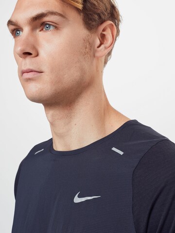 NIKE Functioneel shirt 'Breathe Rise' in Blauw