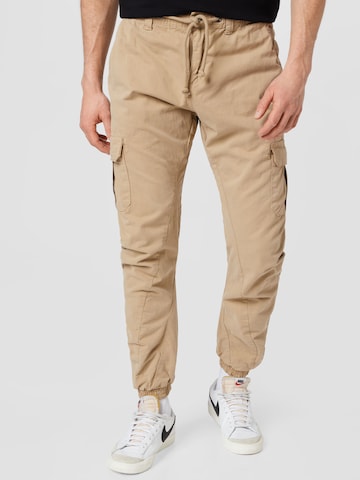 Urban Classics Tapered Cargo Pants in Beige: front