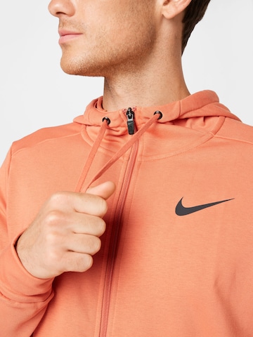 NIKE Sportsweatjacke in Orange