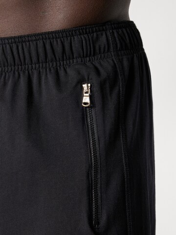 Champion Authentic Athletic Apparel Loosefit Shorts in Schwarz