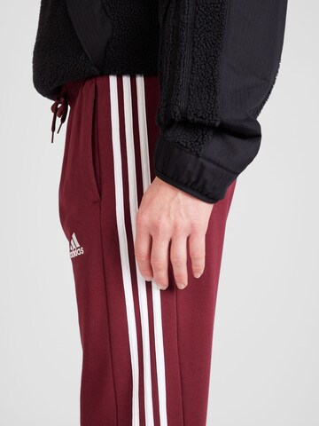 ADIDAS SPORTSWEAR Tapered Sports trousers 'Essentials' in Red