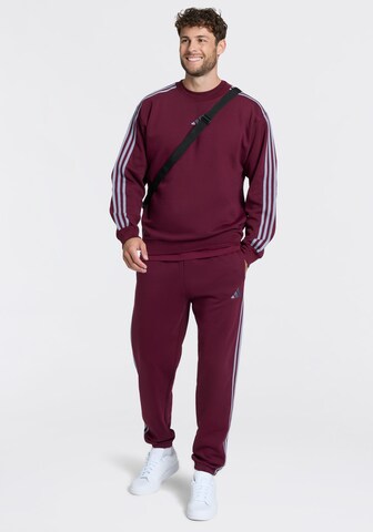 ADIDAS SPORTSWEAR Tapered Pants in Red: front