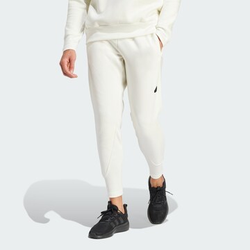 ADIDAS SPORTSWEAR Tapered Workout Pants in White: front