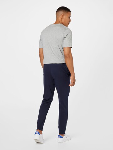ADIDAS SPORTSWEAR - Tapered Pantalón deportivo 'Essentials Tapered Cuff' en azul