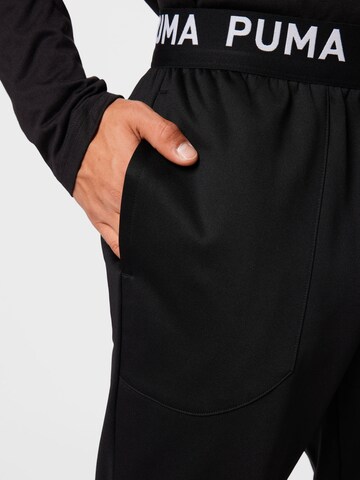 Effilé Pantalon de sport PUMA en noir