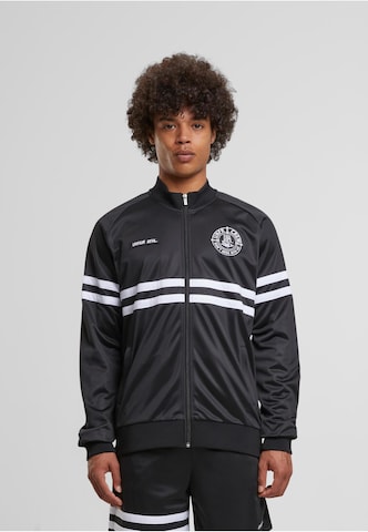 Unfair Athletics Between-season jacket in Black: front