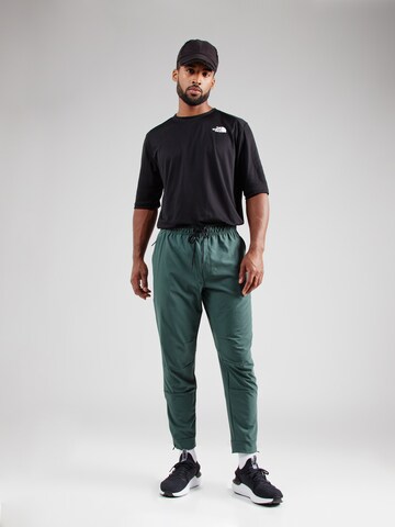 NIKE Конический (Tapered) Спортивные штаны 'UNLIMITED' в Зеленый