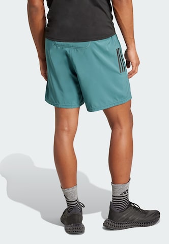 regular Pantaloni sportivi 'Own The Run' di ADIDAS PERFORMANCE in verde