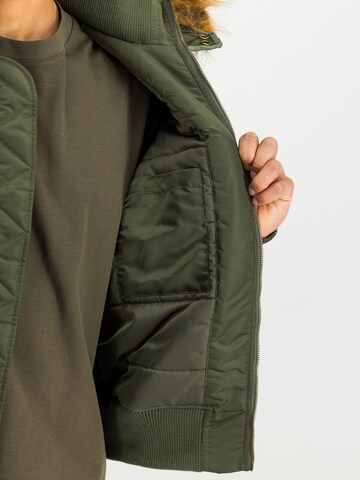 ALPHA INDUSTRIES Between-Season Jacket 'Deflector' in Green: front
