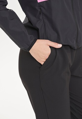 ENDURANCE Tapered Sports trousers 'Wind' in Black