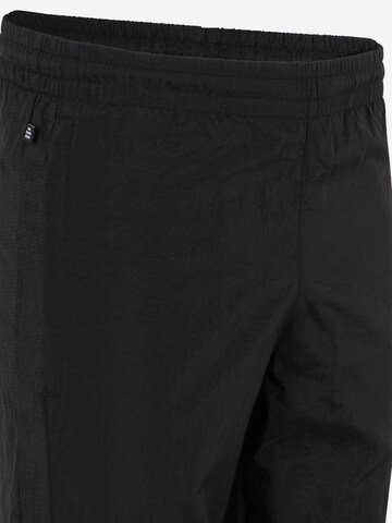 Effilé Pantalon 'Reveal Material Mix' ADIDAS ORIGINALS en noir