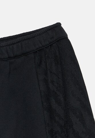 NIKE Loosefit Sportbroek in Zwart
