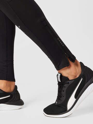 PUMA - Skinny Calças de desporto em preto