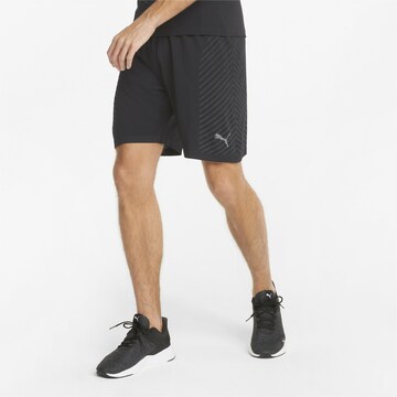 PUMA Regular Sports trousers in Black: front