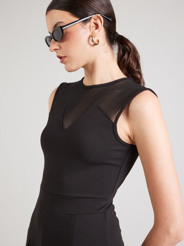 Tuta jumpsuit 'Charlott' di ABOUT YOU in nero