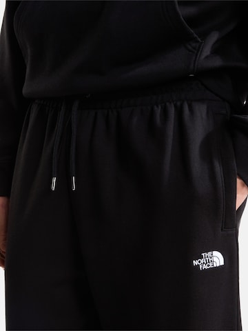 THE NORTH FACE Конический (Tapered) Штаны 'EssentialL Simple Dome' в Черный