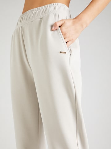 Athlecia - Tapered Pantalón deportivo en gris