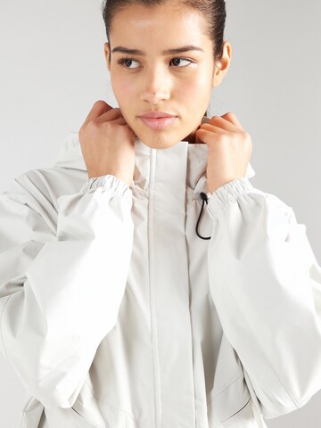 Veste de sport 'SWIFT' NIKE en blanc