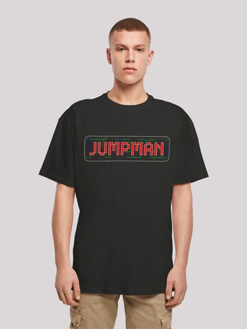 F4NT4STIC Shirt 'Jumpman C64 Retro Gaming SEVENSQUARED' in Zwart: voorkant
