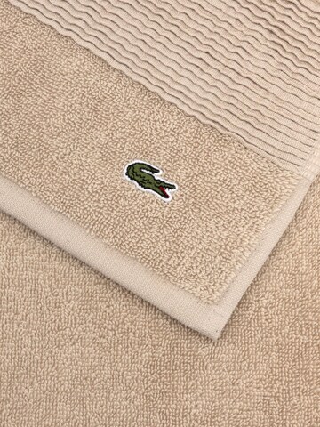 LACOSTE Handtuch 'LLECROCO'‌‌‌‌‌‌ in Braun