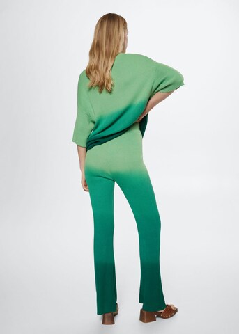 MANGO Rozkloszowany krój Spodnie w kolorze zielony