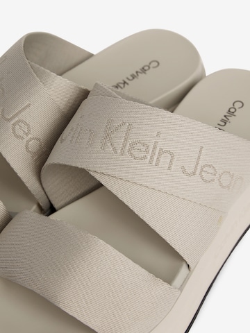 Calvin Klein Jeans Mules in Beige