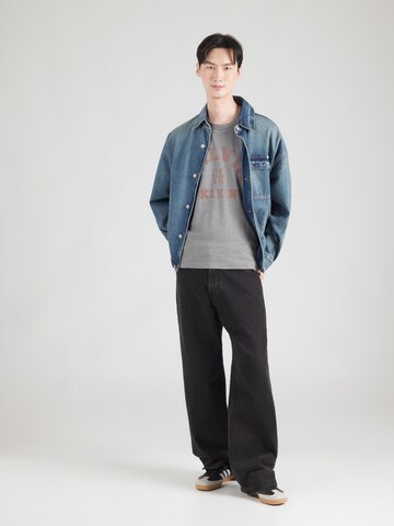Calvin Klein Jeans Tričko '20S COLLEGE' - Sivá