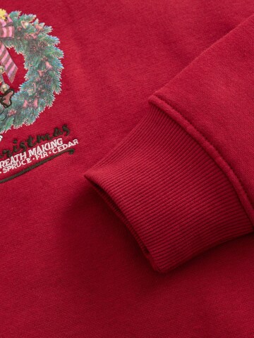 Next - Sudadera 'Snoopy' en rojo