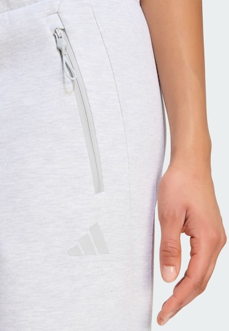 ADIDAS SPORTSWEAR - Tapered Calças de desporto 'Z.N.E.' em cinzento